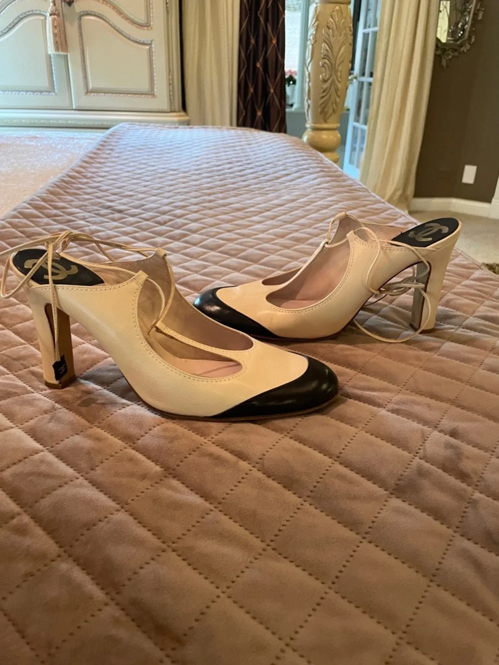 CHANEL Two-Tone T-Strap Pumps in Cream and Black with Logo Heel